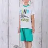 a boy standing next to a toy dinosaur